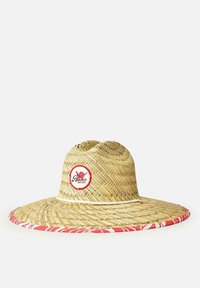 Cappello di paglia a tesa larga con un motivo intrecciato, caratterizzato da una banda decorativa rossa e bianca e un logo circolare con la scritta "Aloha Rip Curl."