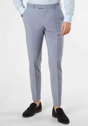 Light blue tailored trousers with a textured finish, slim fit, flat front, and side pockets. Worn with black loafers.