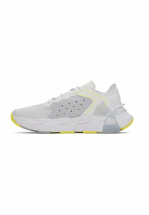 White athletic shoe with mesh panels, rubber sole, reflective gray accents, and yellow details on the sole and design lines.