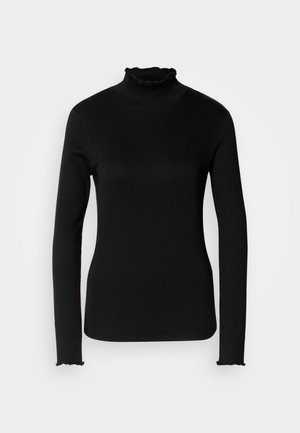 Top de cuello alto de manga larga negro con tejido suave, presenta acentos con volantes en el cuello y los puños, corte entallado y costuras mínimas.