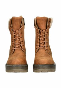 Bruine leren enkelboots met veters, bontvoering bij de kraag, metalen ritsen en gestructureerde rubberen zolen. Flat heel ontwerp.