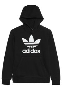Sudadera negra de Adidas con el logo de trébol blanco y texto en el pecho, bolsillo canguro en la parte frontal y capucha integrada.