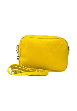 Yellow leather crossbody bag with a textured surface, rectangular shape, zip closure, and a detachable strap. Features a small tricolor accent.