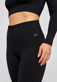 SNOCKS Legging - schwarz