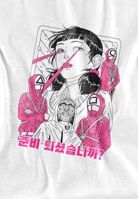 Graphic t-shirt featuring a white background, black and pink illustration of a girl with laser eyes, flanked by masked figures and Korean text.