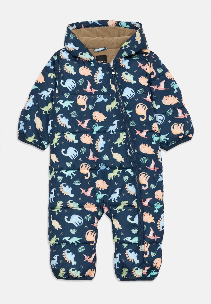 Ναυτικό μπλε κοστούμι χιονιού για νήπια με πολύχρωμα σχέδια δεινοσαύρων και φυλλωμάτων, μπροστινός φερμουάρ, προσαρμοσμένη κουκούλα και καστανή φλις επένδυση μέσα στην κουκούλα.