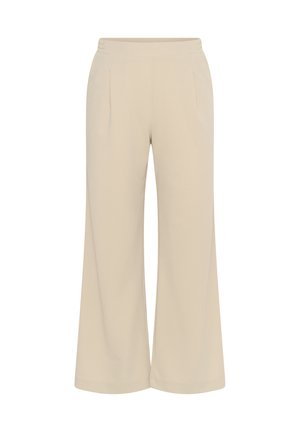 Pantalon large beige avec taille élastique, plis à l'avant et poches latérales, conçu pour une coupe décontractée.