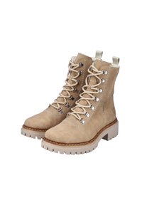 Botas de tobillo de ante beige con cierre de cordones, ojales de metal, costuras en contraste y una suela de goma blanca gruesa. Tiradores en los puños.
