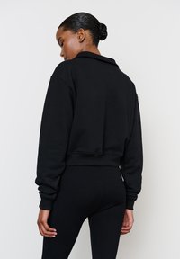 LA MANIA Mikina so zipsom - black