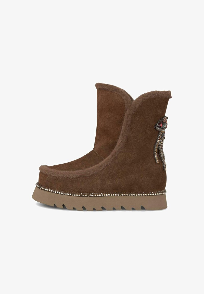 Brown suede ankle boot with faux fur lining, embellished with beaded detail and decorative accents. Features a thick rubber sole.