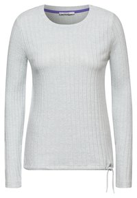 Haut à manches longues gris clair avec texture côtelée, col rond et détail de cordon au bord inférieur. Le tissu semble doux et extensible.