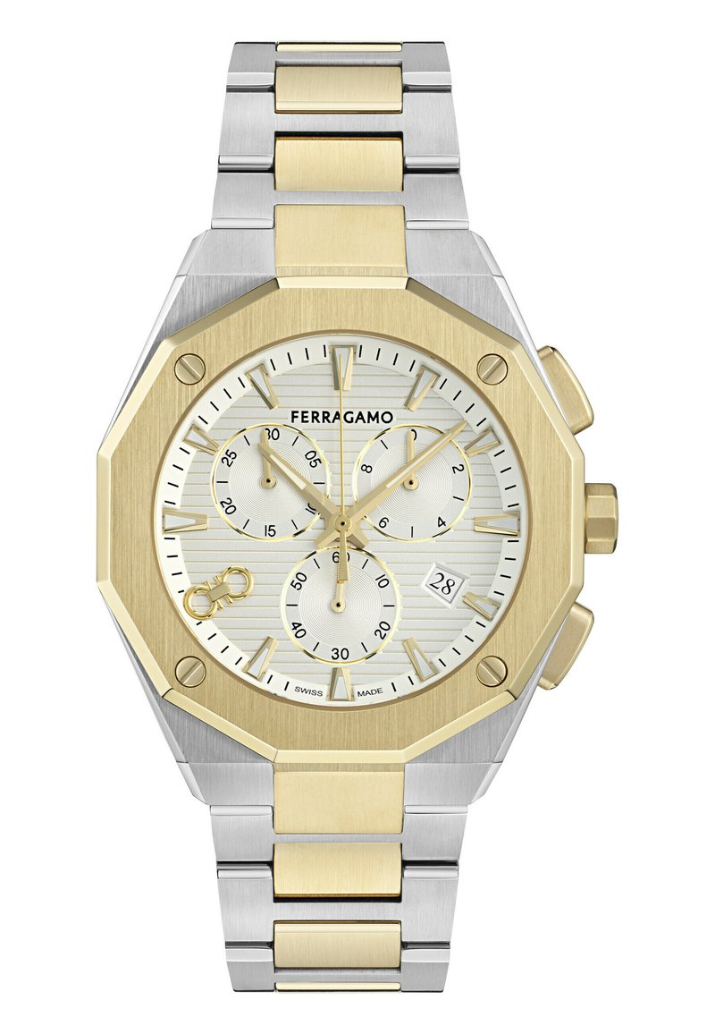 Montre en acier inoxydable argenté et doré avec un cadran octogonal, un cadran blanc texturé, trois sous-cadrans et un affichage de la date à 6 heures.