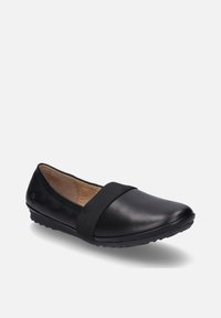 Black leather flats with a rounded toe and elastic band across the instep. Textured rubber sole with small grips. Simple, sleek design.