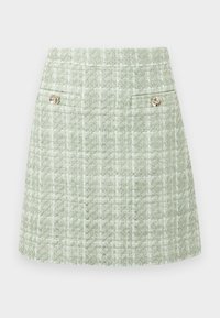 Groene tweed mini-jurk met een geprofileerd patroon, voorzien van twee decoratieve knopen in de taille en een gestructureerde pasvorm.