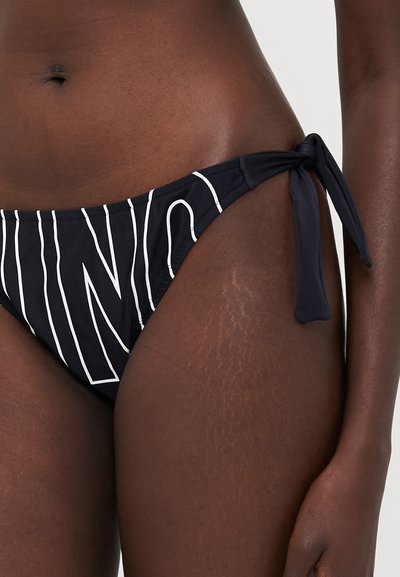Black bikini bottom with white vertical stripes. Features adjustable side ties. Smooth fabric with a fitted cut.