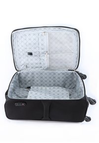Black suitcase with smooth exterior, spacious interior, grey patterned lining, zippered compartments, and four wheels for mobility.