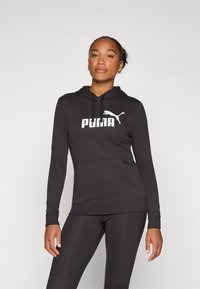 Felpa nera con cappuccio realizzata in morbido tessuto, maniche lunghe, tasca a marsupio e logo Puma bianco sul petto. Progettata per attività sportive o per un look casual.