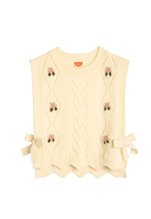 Chaleco de bebé color crema de punto con un centro de trenzas, patrones en forma de diamante florales, dobladillo con volante y lazos laterales.