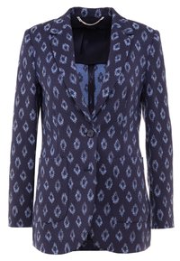 Marinblå blazer med ett mönstrat lager som har ljusblå diamanter, enkel knappstängning och två framfickor.