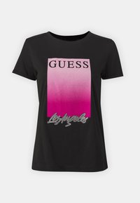 Zwarte t-shirt met korte mouwen, voorzien van een gradiënt roze rechthoekig ontwerp met de tekst "GUESS" en "Los Angeles" met strass-accenten.
