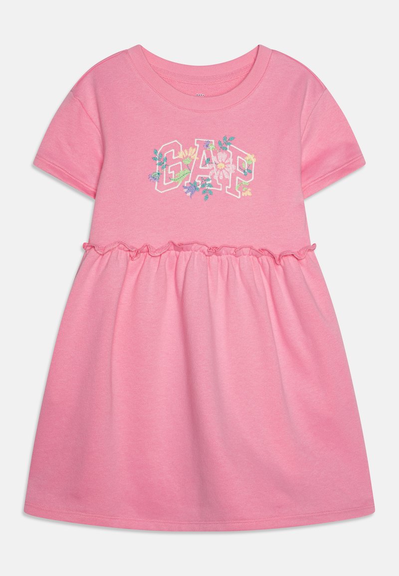 Pink cotton dress featuring a gathered waist, short sleeves, and embroidered "GAP" logo with floral accents. Soft texture and casual design.
