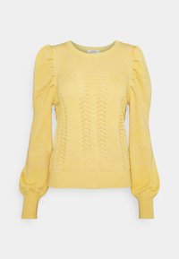Pull-over tricoté jaune avec un motif texturé, des manches bouffantes et des poignets et ourlets côtelés. Design léger et décontracté.