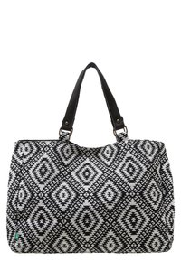 Svart och vit mönstrad tote-väska med diamantdesign, tillverkad av tyg, och två stadiga handtag i svart läder.