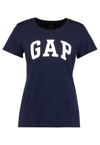 Mörkblå bomullströja med rund halsringning och vitskriven "GAP" logotyp över bröstet. Kortsleeves och en klassisk passform.