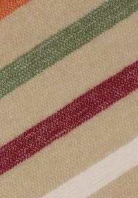 Striped fabric featuring beige, orange, green, red, and white lines; soft texture with a woven appearance. Ideal for textiles or upholstery.