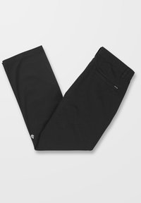 Pantalones negros hechos de una tela suave, con un corte recto, bolsillos laterales y una pequeña etiqueta con logo en la parte posterior.