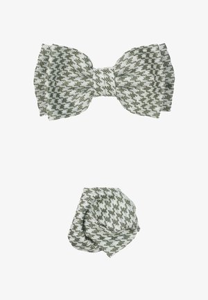 Groen en witte houndstooth-patroon strik en kleinere knoopaccessoire gemaakt van geweven stof, met een gestructureerd uiterlijk en gedefinieerde vormen.