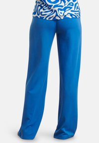 Blue wide-leg pants made of smooth, stretchy fabric. The pants feature a minimalist design and sit at the waist for comfort.