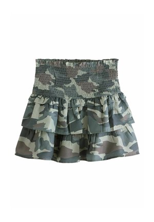 Tüllrock mit Camouflage-Muster und gerüschtem Bund, bestehend aus drei Rüschenschichten in gedämpften Grün- und Grautönen. Leichtes Material.