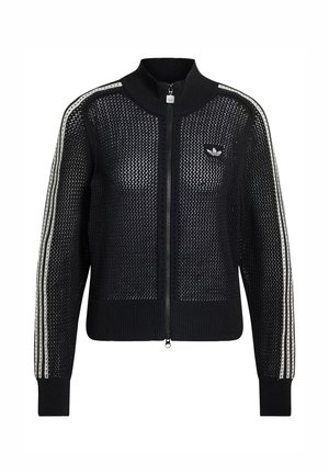 Svart stickad zip-up-kofta med mesh-design, med vita sidostripes och en liten logotyp på bröstet. Ribbad krage och mudd.