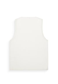 Top senza maniche di colore bianco, a coste, con una vestibilità ampia e scollo rotondo. Tessuto liscio senza ulteriori fantasie o accessori.