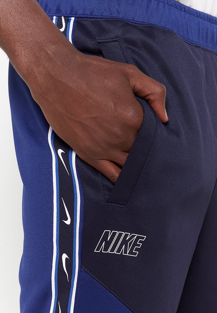 nike repeat poly track pants