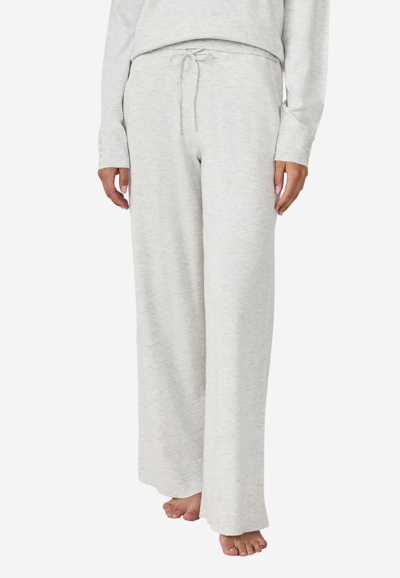 Lichtgrijze sweatpants met een ontspannen pasvorm, voorzien van een elastische tailleband met een trekkoord en ribgebreide boorden, gemaakt van zachte stof.