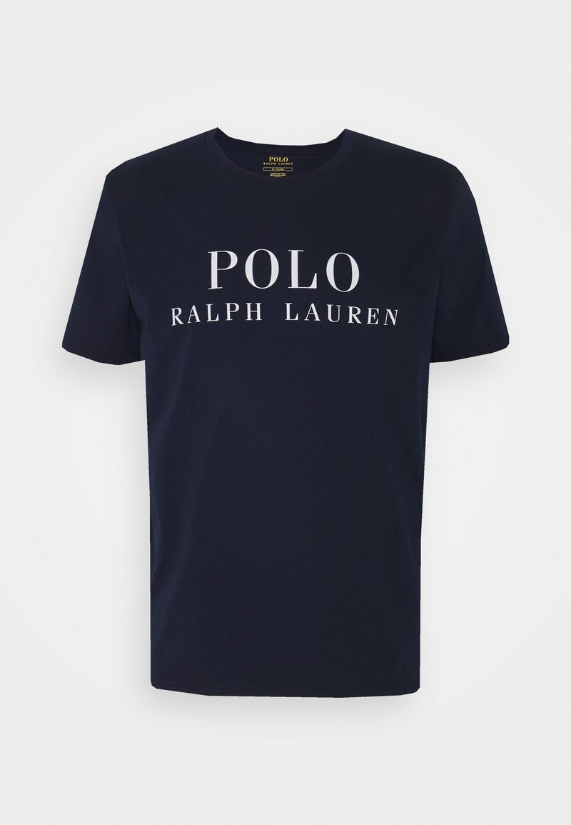 T-shirt di cotone blu navy con grande testo bianco "POLO" e "Ralph Lauren". Classico scollo rotondo e maniche corte. Texture liscia.