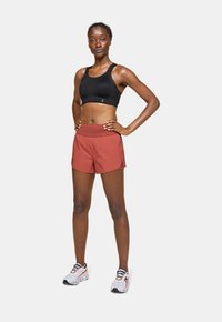 On PERFORMANCE FLEX  - Medium support sports bra - black