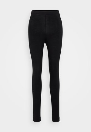 Leggings pretos feitos de um tecido macio e elástico. Apresentam uma textura suave, silhueta ajustada e uma cintura elástica para conforto.