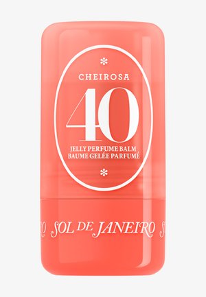 Korallenfarbener zylindrischer Behälter des Sol de Janeiro Cheirosa 40 Jelly Parfümbalsams mit weißem Text und abgerundeten Kanten.