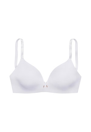White smooth cup bra with thin adjustable straps and small decorative bow at center front on plain background.