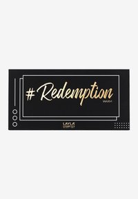 Schwarze Verpackung mit goldfarbener Prägung, die "# Redemption" und "WARM." zeigt. Sie hat ein geometrisches Design mit weißen Umrissen und Punkten.