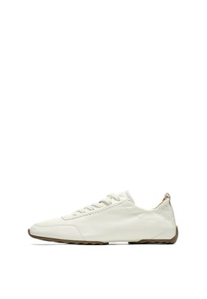 White low-top leather sneaker with white laces and a brown rubber sole, shown from the side on a white background.
