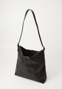 Dark brown leather shoulder bag with a wide adjustable strap and partially open zipper showing interior pockets.