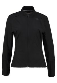Veste de sport noire avec col montant, manches longues et fermeture éclair sur toute la longueur. Tissu doux et texturé avec poches latérales et détail du logo.