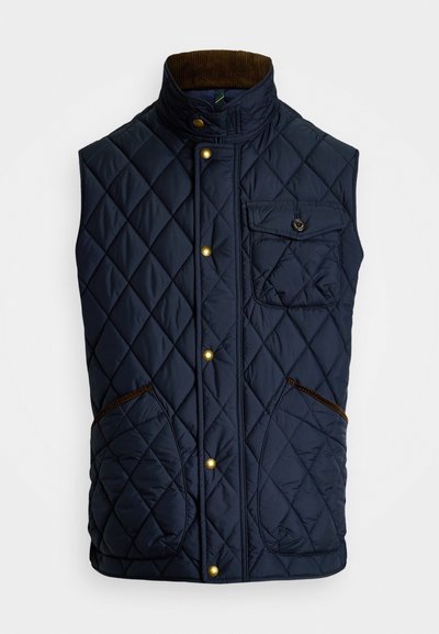 Jūras flotes pīto vesti ar augstu apkakli, zeltītēm pogām, kabatu ar ielādi un brūniem korduroja akcentiem pie apkakles un kabatām.