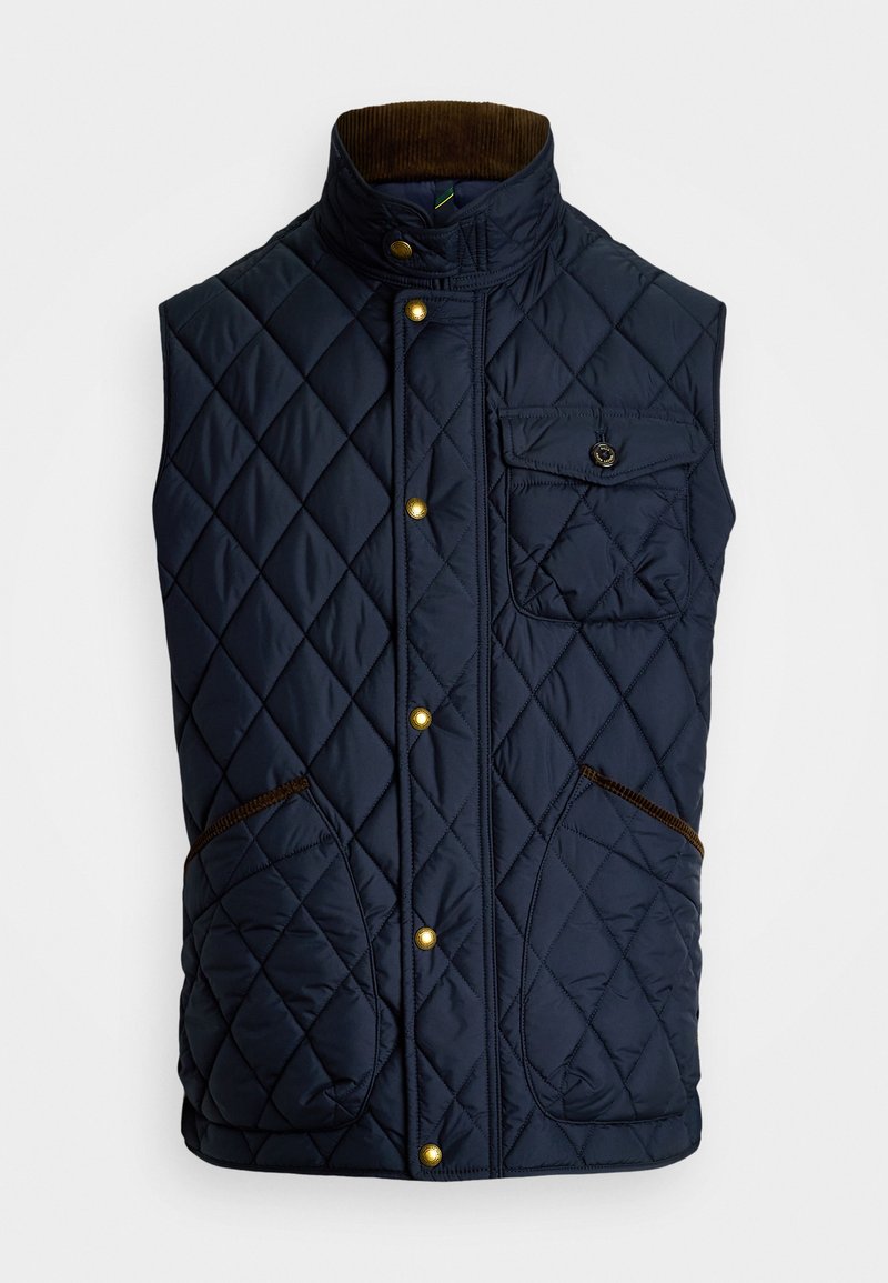 Gilet trapuntato blu navy con colletto alto, bottoni a pressione oro, tasca applicata e dettagli in velluto corduroy marrone sul collo e sulle tasche.