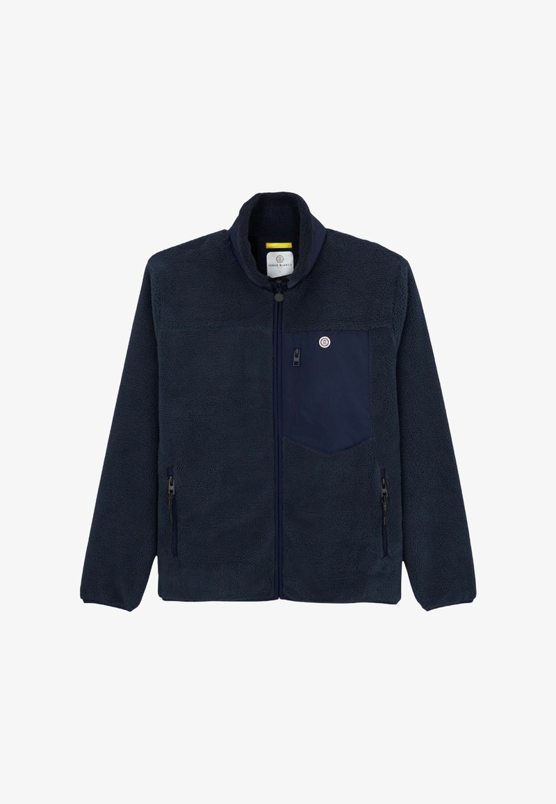 Veste en polaire bleu marine avec fermeture éclair intégrale, col montant, poche poitrine zippée et deux poches latérales zippées.