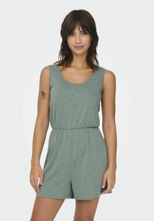 Ljusgrön ärmlös jumpsuit gjord av ett mjukt, texturerat tyg med elastisk midja och rund halsringning.